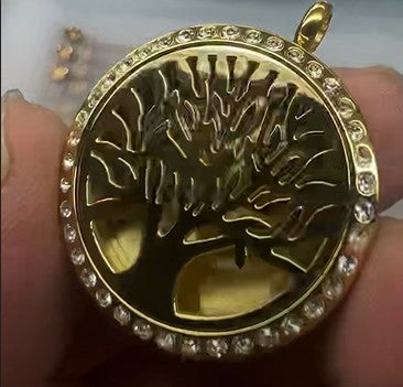Well Building Connection Logo on Tree of Life Pendant. Portable Wellness: A Tree of Life aromatherapy necklace offers portable, discreet wellness benefits by diffusing essential oils throughout the day, helping to manage stress, boost energy, or improve focus. The locket made of hypoallergenic stainless steel, acts as a personal, stylish diffuser, while the Tree of Life symbol represents growth, strength, and harmony. On-the-Go Aromatherapy: It allows you to breathe in essential oils for stress relief.