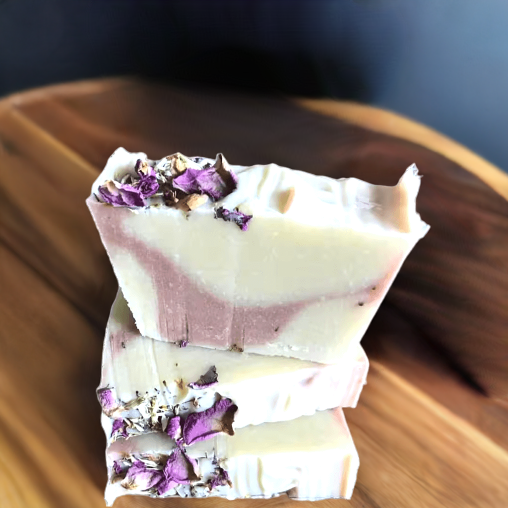 Handmade natural soap bar with lavender and rose petals embedded in the surface. Lavender Livy and Mia Rose Hand-Made Natural Soap

Indulge in the soothing, aromatic experience of Lavender Livy &amp; Mia Rose Handmade Natural Soap, crafted with love and care using 100% natural ingredients. This luxurious soap bar combines the calming essence of lavender with the delicate, floral notes of Mia rose, creating a relaxing and rejuvenating bathing experience.
Handmade in small batches at Well Building Connection
