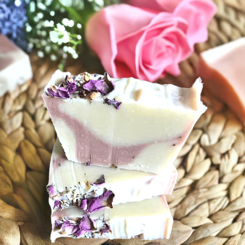 Handmade natural soap bar with lavender and rose petals embedded in the surface. Lavender Livy and Mia Rose Hand-Made Natural Soap
Indulge in the soothing, aromatic experience of Lavender Livy &amp; Mia Rose Handmade Natural Soap, crafted with love and care using 100% natural ingredients. This luxurious soap bar combines the calming essence of lavender with the delicate, floral notes of Mia rose, creating a relaxing and rejuvenating bathing experience.

Handmade in small batches at Well Building Connection