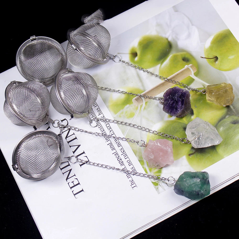 stainless steel tea strainers with fine mesh, each attached to a different raw crystal stone on a chain, displayed on a white surface with green apples in the background. Tea Strainer with Natural Raw stones -Crystals – Infuse Your Tea with Elegance and  Energy

Enhance your tea ritual with our Tea Strainer with Natural Raw Stones - Crystals, a perfect blend of functionality, beauty, and holistic energy. Designed for tea lovers and crystal enthusiasts alike.